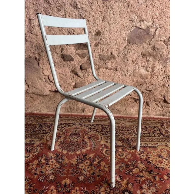 Series of 4 sky blue metal chairs, Art-Prime brand. Fabricated in gray in Haute Saône in the 1950s. Formerly used in bars,...