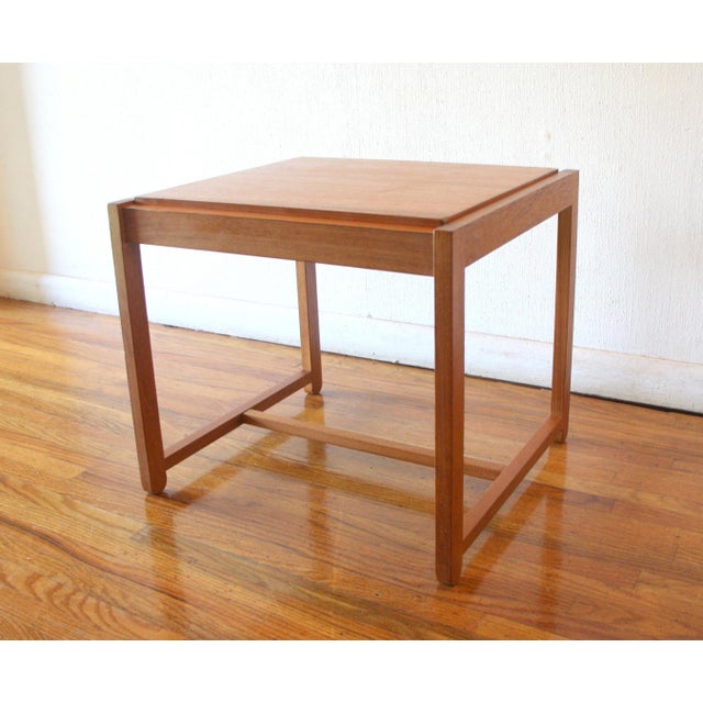 This is a mid century modern Danish teak side table ottoman designed by Eric Buch for O.D. Mobler (Oddense...