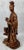 Chinese carved teak female figure with a removable head. She holds a Ruyi (scepter) in her hands and has a dog at her...