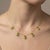 Delicate, radiant, and effortlessly elegant, this Peridot Dangle Station Necklace features five beautifully faceted oval-...