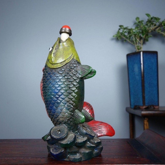 This is a charming vintage Chinese snuff bottle, crafted from Liuli (traditional Chinese glass) in the sculptural form of...