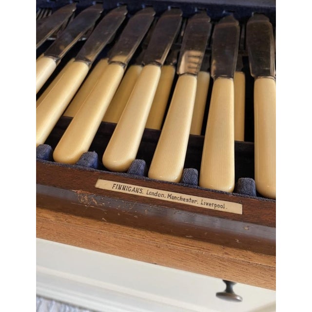 Elegant antique fish cutlery set by Finnigans, the prestigious British luxury house founded in the 19th century, on par...