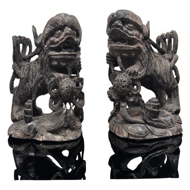 Mid 20th Century Pair of Intricately Carved Wooden Foo Dogs For Sale