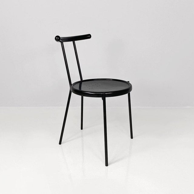 Italian modern round Chair in black wood and metal rod, 1980s Chair with round perforated seat in black painted wood....