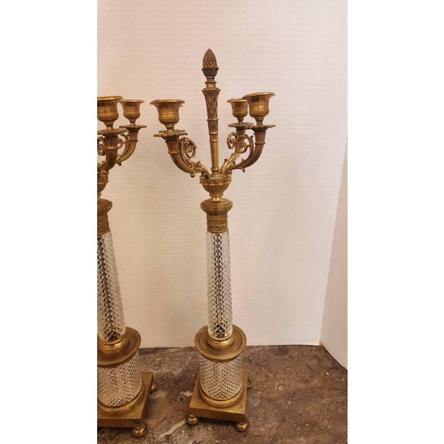 Late 19th/20th c., four-arm, diamond cut crystal and gilt bronze candelabra, drilled for lamps but not electrified, unmarked
