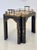 A Regency style side table in black lacquer with gilt detailing, hand-painted Chinoiserie floral decoration, and an...