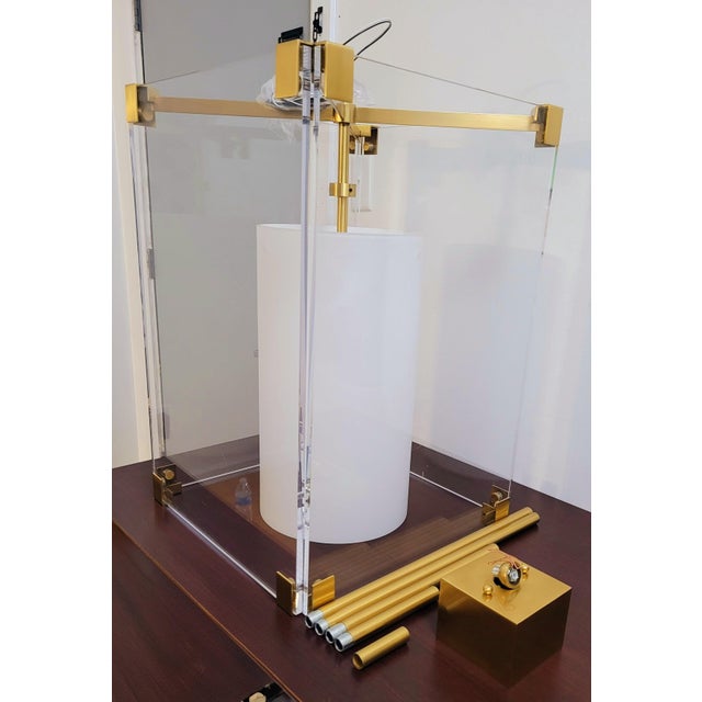 A sculptural and sophisticated Hudson Valley Lighting “Achilles” 4132 Large 3‑Light Pendant, featuring a striking...