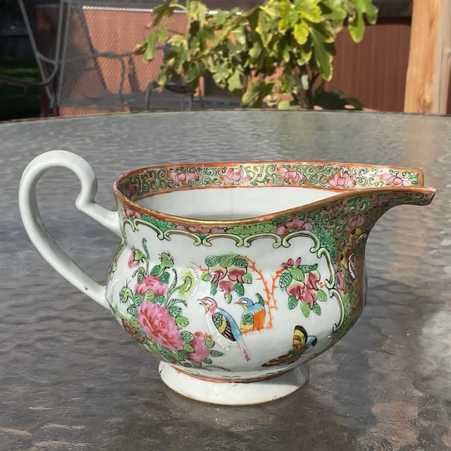 Famille Rose Medallion Hog Nose Creamer that is exquisite with the hand painted detail. It has birds and butterflies, and...
