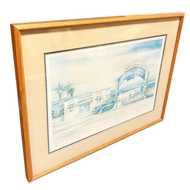 Vintage framed coastal art print featuring the iconic Santa Monica Yacht Harbor entrance with classic California seaside...