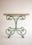 Late 19th c. French iron pastry or patisserie table, with original travertine top. The removable travertine top sits on a...