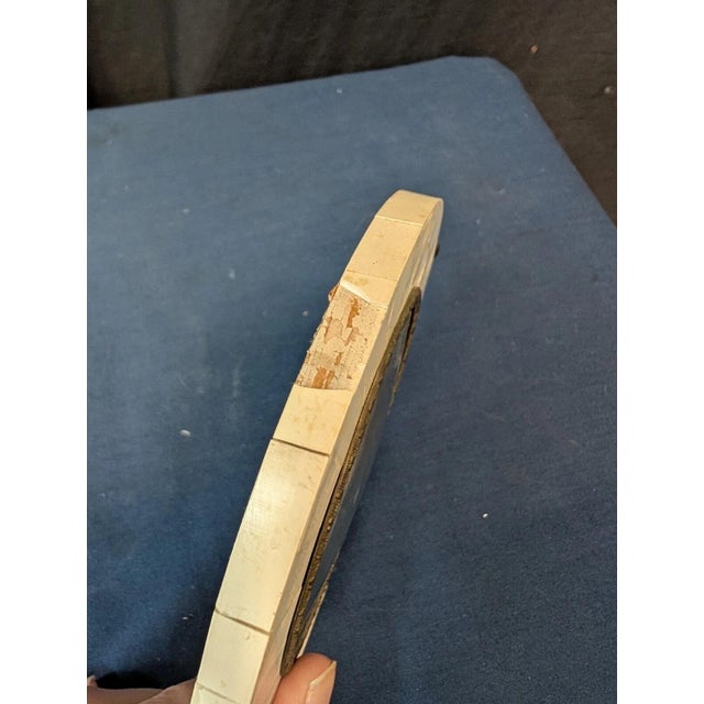 This vintage continental watercolor painting of two children is circa the nineteenth century. Featured within an oval...