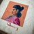 This small but impactful original oil painting by artist John Gaitha Browning (1912–1992) features a simple portrait of a...