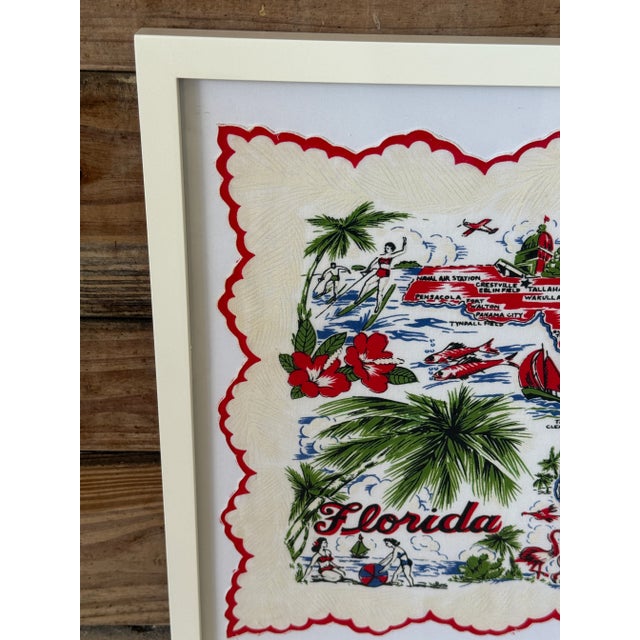 A cheerful slice of Old Florida charm, this vintage Florida souvenir handkerchief has been professionally mounted and...