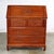 Handsome Asian teak hand carved drop slant front desk with interior compartmentalized cubby storage in the style of George...