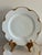 An elegant set of 10 vintage Haviland & Co. Limoges porcelain plates, each with a graceful wavy scalloped edge finished in...