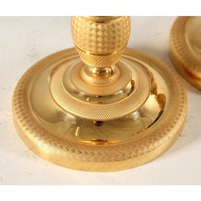 Two antique gilded candlesticks France Gilt bronze circa 1820 Dimensions: Height: 27 cm, diameter: 12 cm Classic French...