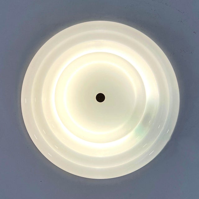 Lin Wall Lamp by Kazuhide Takahama for Sirrah, 1970s, in Good conditions. Designed 1970 to 1979 This piece has an...
