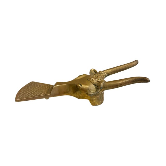 A charming, vintage brass boot jack. Features a cast longhorn form in solid brass. Labeled “Southern Ent. Inc. Dallas,...