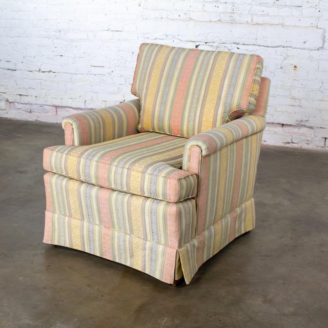 Lovely vintage Traditional club chair by Henredon composed of rolled arms, loose T style poly wrapped foam seat cushion,...