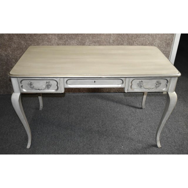 Vintage (1960s) Writing Desk has a Venetian Style. Made by Baker Part of the "Millings Road" Collection. The Desk has...