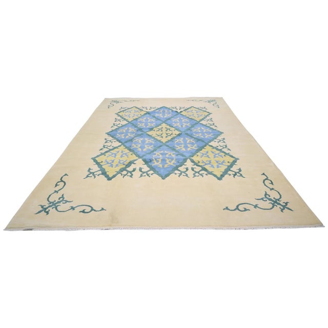 Hand-knotted with care using traditional rug-making techniques, this wool rug blends timeless craftsmanship with a modern...