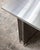 STAINLESS STEEL TABLE Constructed from 2mm brushed stainless steel panels, the table’s precise silhouette is defined by...