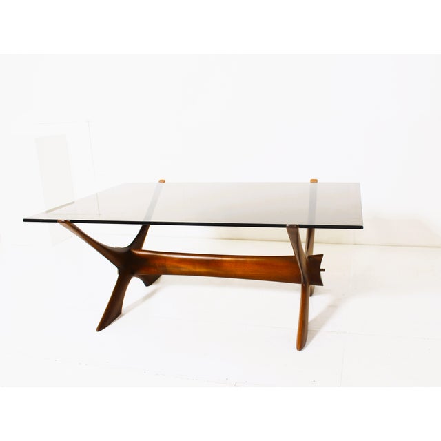 The Condor Coffee Table produced by Örebro Glas and made by Fredrik Schriever-Abeln The table is executed in teak with a...