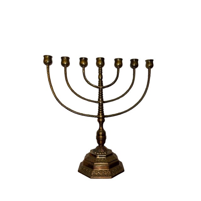 Brass Seven-Arm Candelabrum Europe, early 20th century Solid brass seven-arm candelabrum with turned stem and a stepped,...