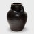 Originally used for fermenting rice or sorghum into vinegar, this earthenware vessel from the early 20th century is coated...