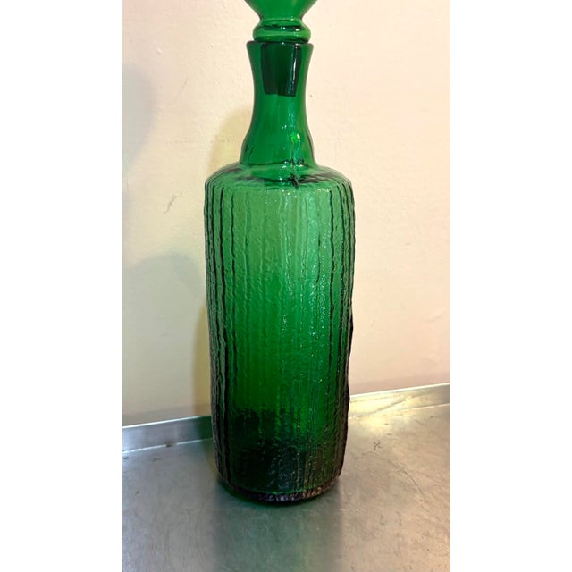 1950s-60s midcentury extra-large green glass bottle/decanter. One small chip in base of top, as shown. It is not visible...