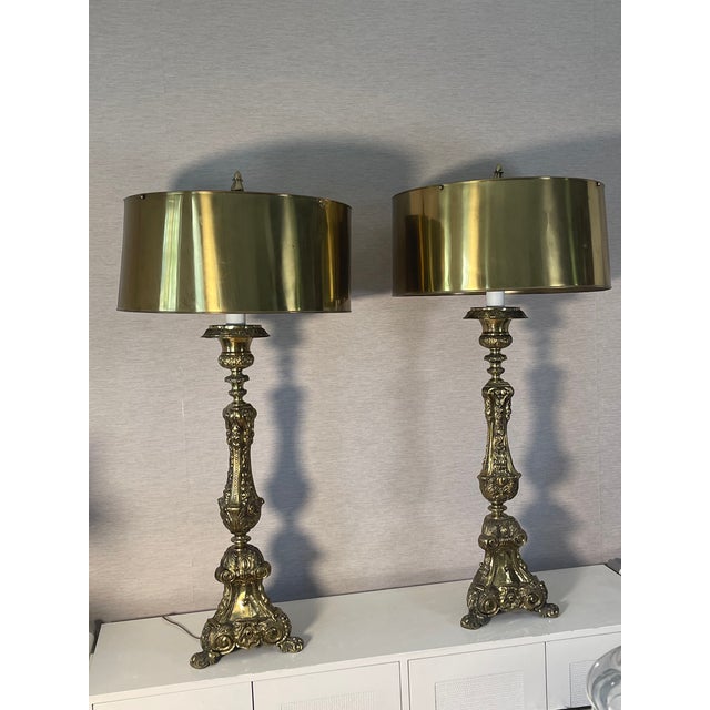 50” Large impressive palatial antique brass lamps in Batoque style with brass shades.