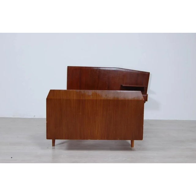 Single bed structure, Italian manufacture dating back to the 1950s. Made entirely of wood. Interesting shapes, the head...