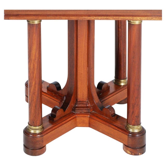 A refined and architecturally balanced 19th-century italian walnut side table, distinguished by its strong geometric...