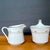 Vintage creamer and sugar bowl set from the Wyndham “Buttercup” pattern, featuring soft yellow and blue florals, delicate...