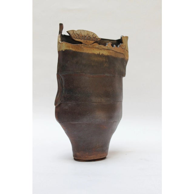 Studio stoneware vase in deep burgundy with ochre applied details (ca. 1970s, USA). Interesting textural and geometric...