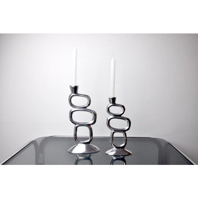 Pair of circle candlesticks designed and produced by matthew hilton in england in the 1980s. Set of two brutalist style...