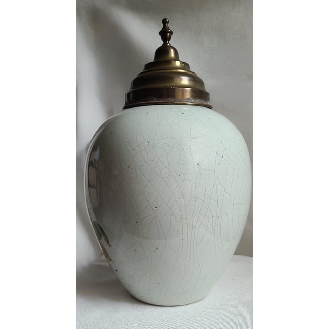 Colonial style delftware pottery tobacco jar from the Netherlands c. 1920 with brass lid depicting men of African and...