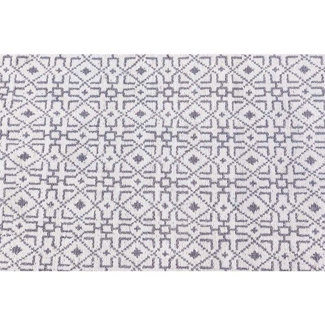 A Midcentury North Indian Agra cotton size adjusted runner features a primitive geometric pattern with diamond shapes in...