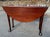 Early mahogany drop leaf table with pad foot Will seat four Original surface with great color Wax finish