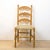 Rustic Spanish wood chair from the 1950's completely restored. Seagrass cord seat, turned legs and carved backrest.
