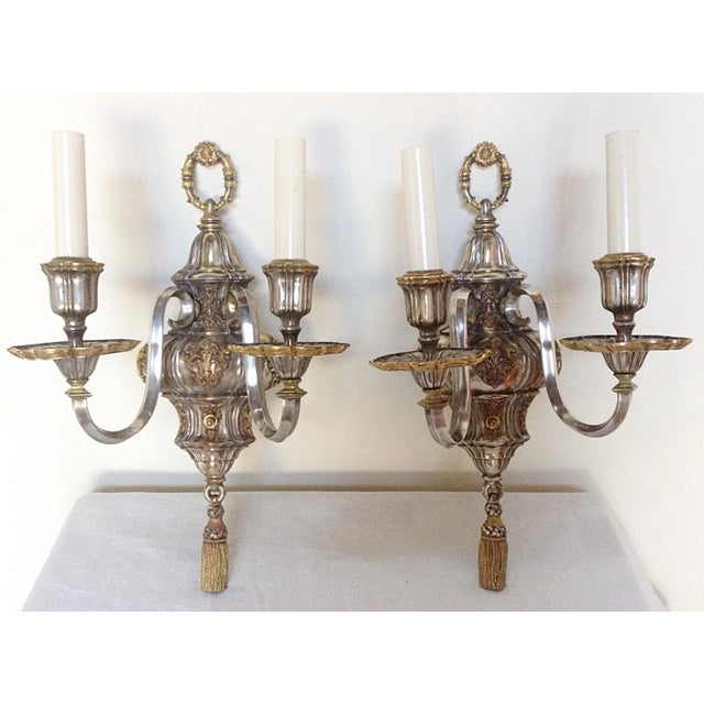 Beautiful pair of Caldwell silver plated and gilt decorated wall sconces with tassel decoration at the bottom and thumb...