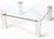 Unusual chromed four cylinder and glass square coffee table. Four chromed steel cylinders have notched openings with...
