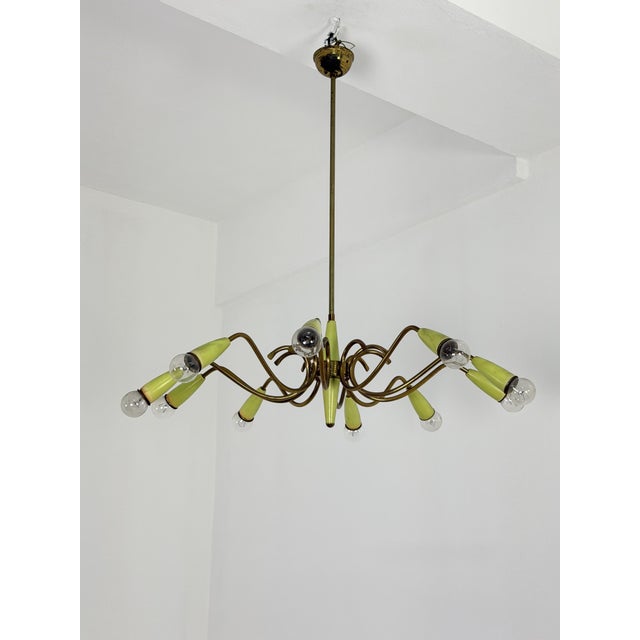 10-light brass chandelier with green cones in the Stilnovo style, 1950s Good condition. Small signs of wear on the colored...