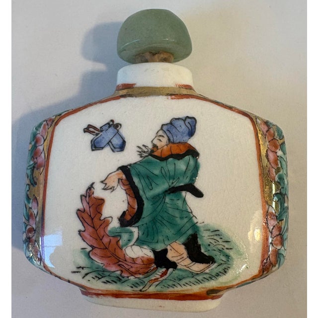 Love this hand painted Chinese snuff bottle with jade top and tiny spoon attached.