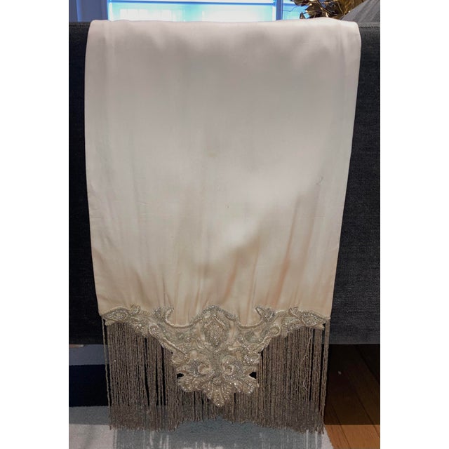 The vintage Embroidered Beaded Fringed Silk Satin Throw is a handmade chair throw made from 100% silk in an antique style....