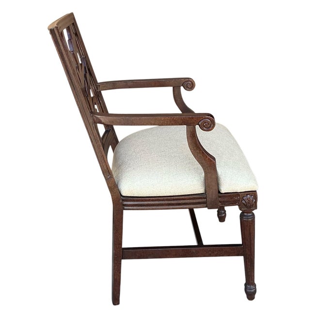 This is a pair of late 20th century bergere chairs with an oil drip faux tortoise finish on the frames. The backs are a...