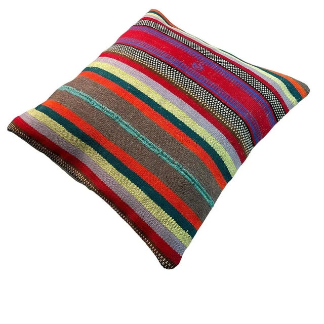 Introducing our handmade Kilim Pillow Cover, measuring 60 x 60 cm, crafted from vintage kilims from the 1970s in Turkey....