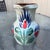 This is a vintage 1970s St. Clément French barbotine ceramic pitcher. It features a hand-painted stylized floral design in...
