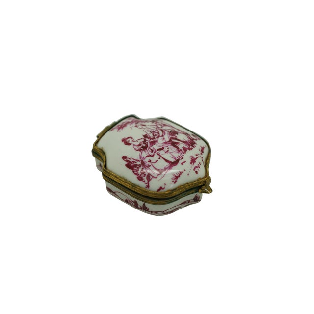 Antique Continental porcelain enameled limoges style pill box featuring a very unique shield or crest shape with gilt...