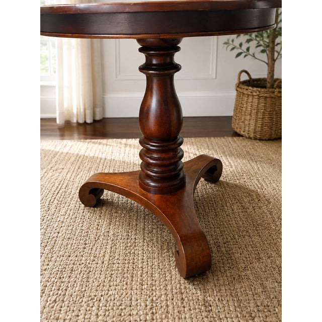 Beautiful Baker Furniture Milling Road “West Indies” mahogany center table, model MR-3067. This elegant vintage table...